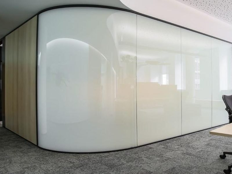 The same curved meeting room wall switched to private