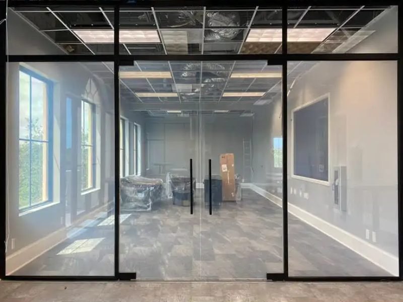 Boardroom with switchable glass double doors and sidelights, clear